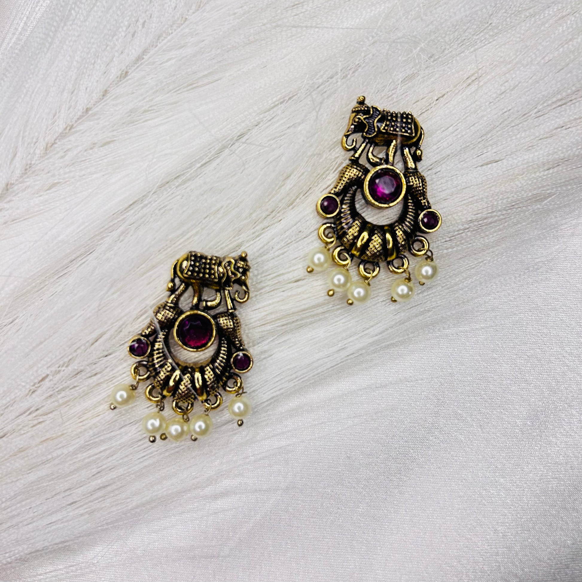 elephant shaped small golden ethnic pink stud earring