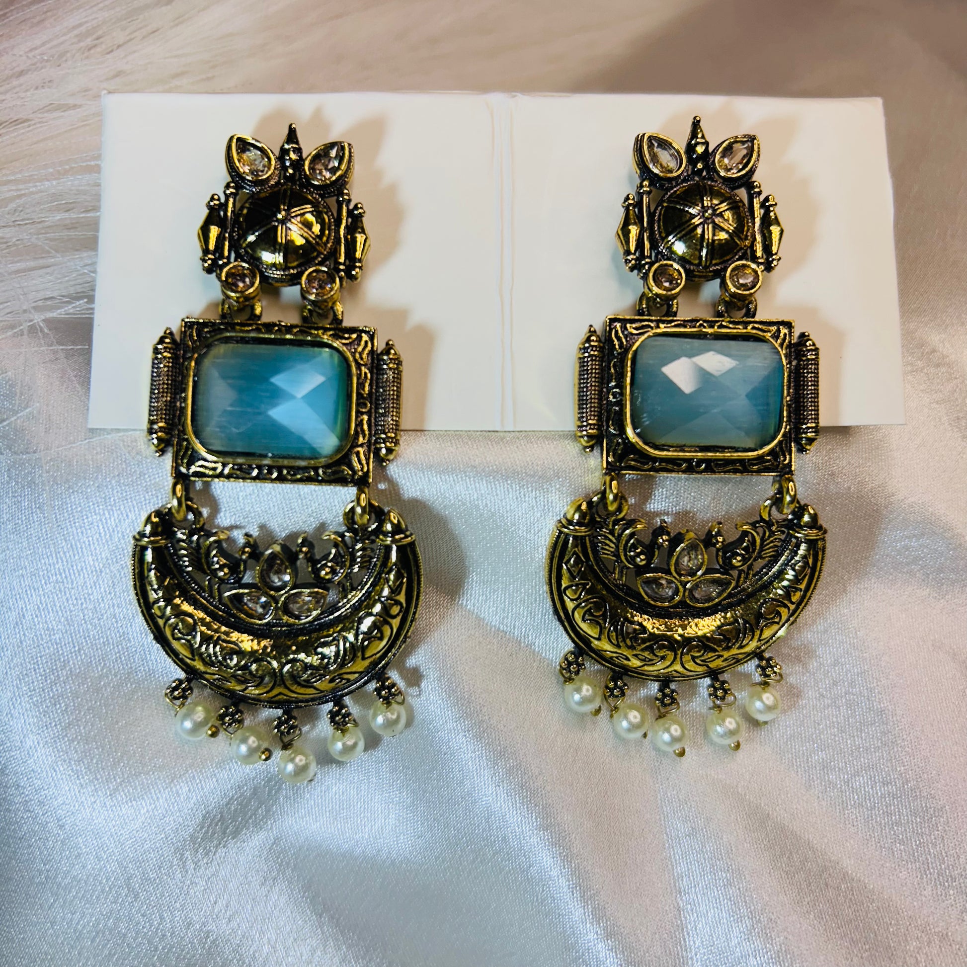 Ethnic Elegance Light Blue Stone Golden Dangler Earrings