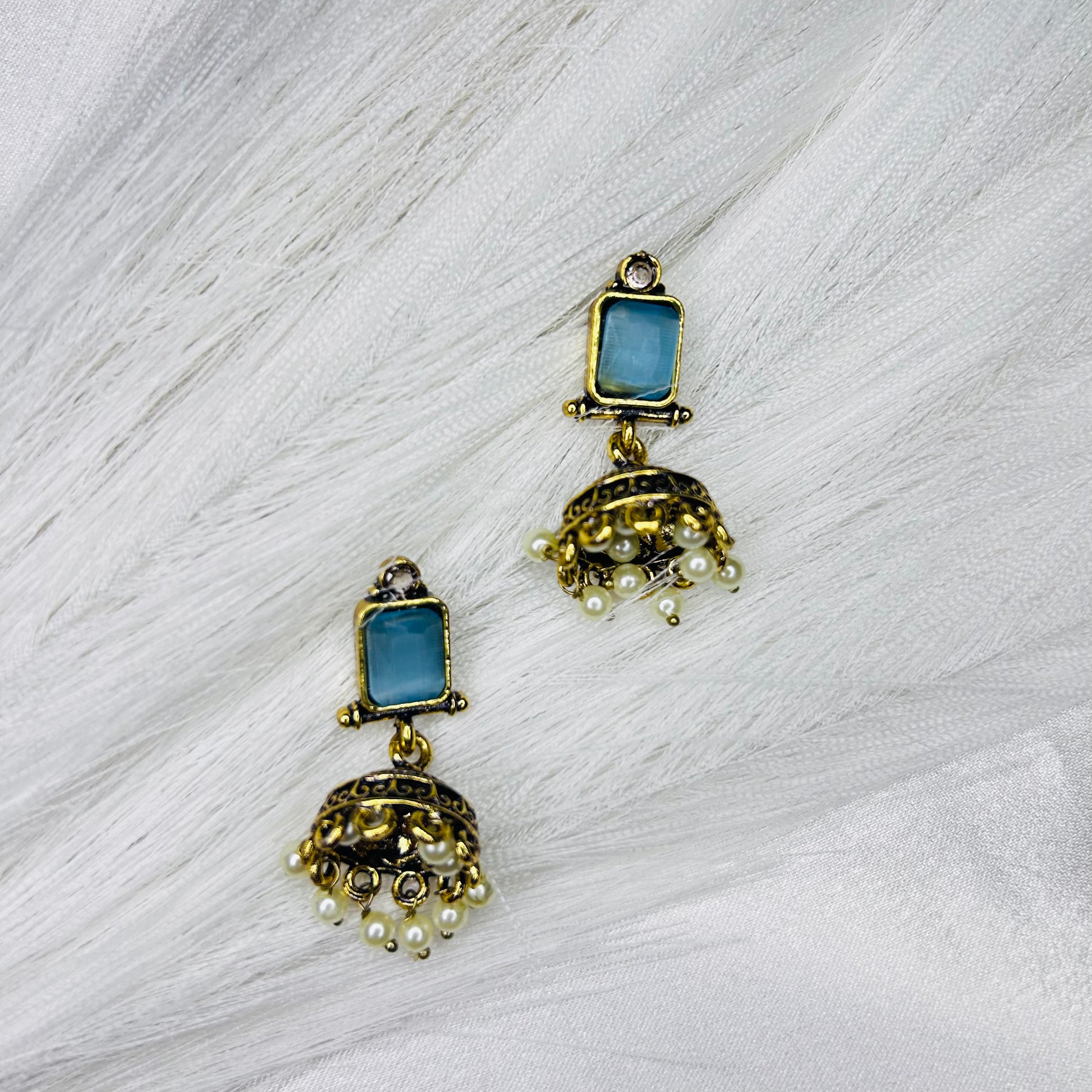 Golden Tone Ethnic Jhumka Earrings with Square Sky Blue Stone